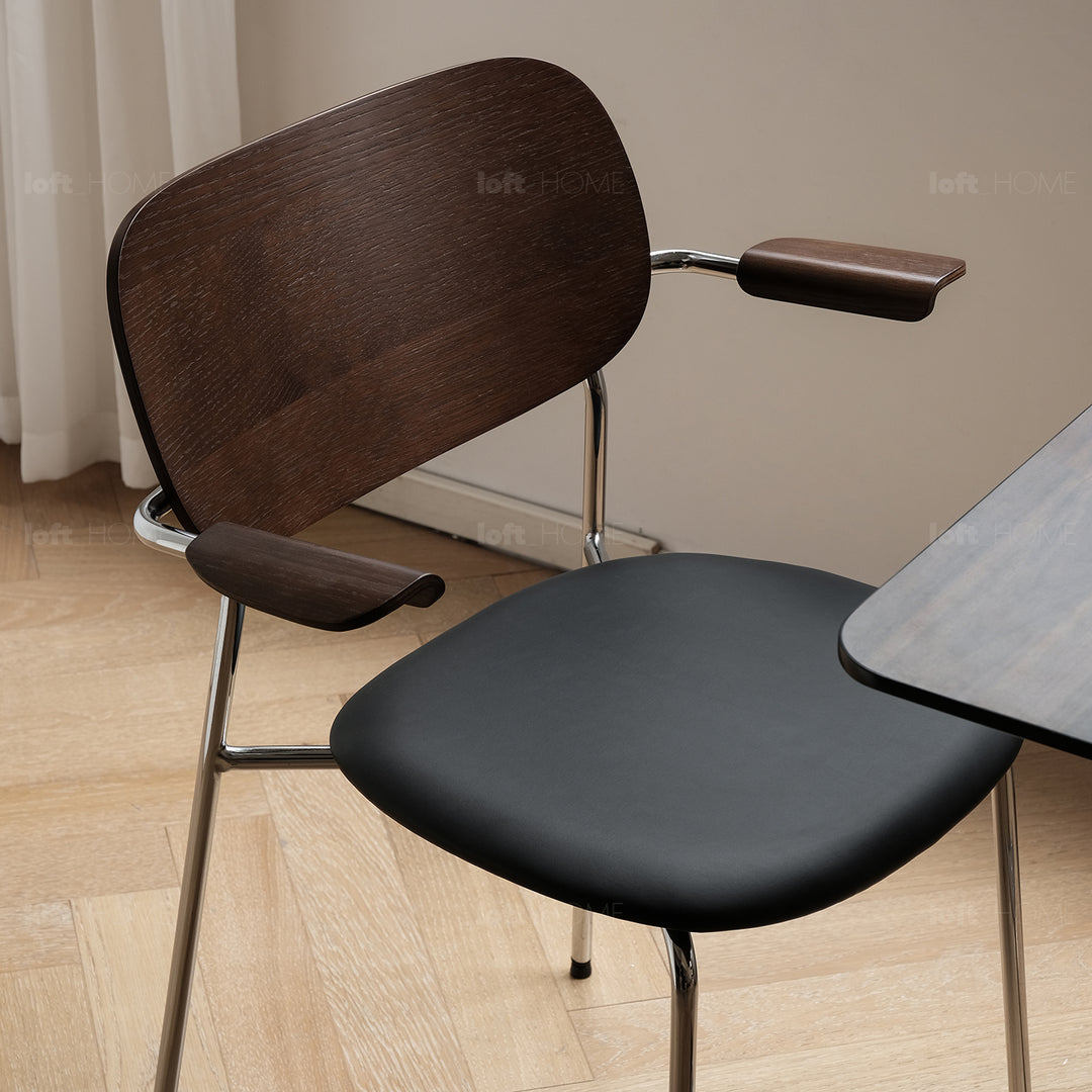 Industrial pu leather dining chair with armrest nika in details.