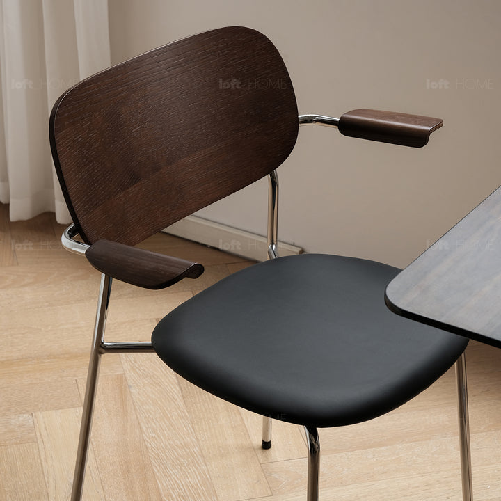 Industrial pu leather dining chair with armrest nika in details.