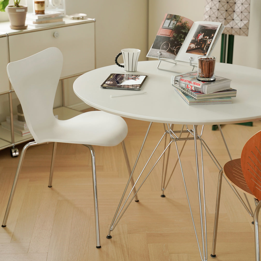 Industrial plywood steel dining table eames in white background.