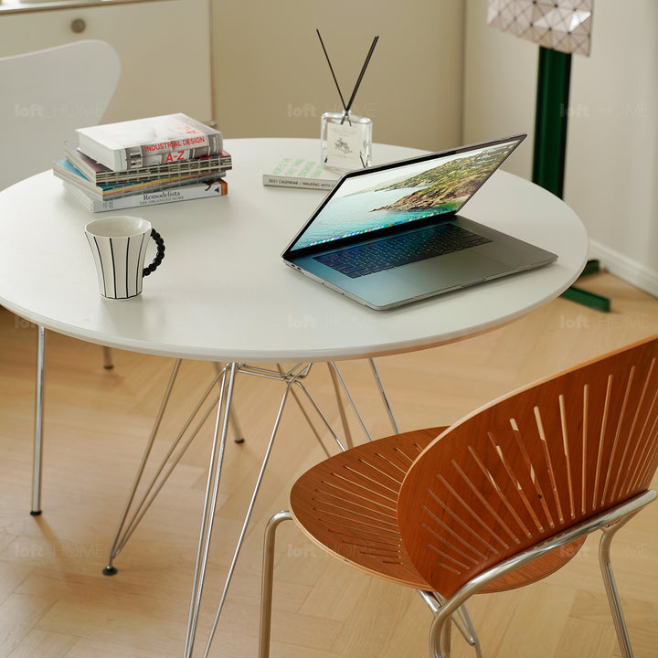 Industrial plywood steel dining table eames in still life.