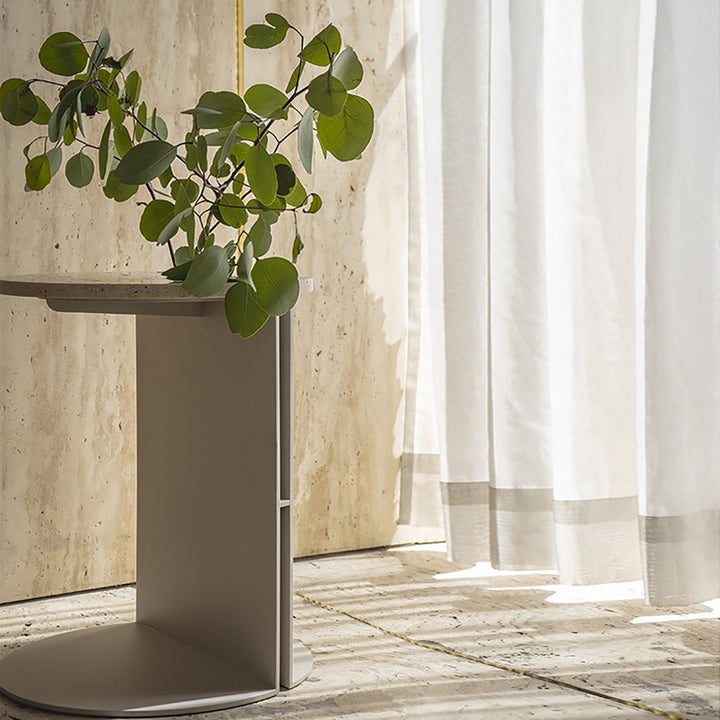 Industrial travertine stone metal side table liska in real life style.