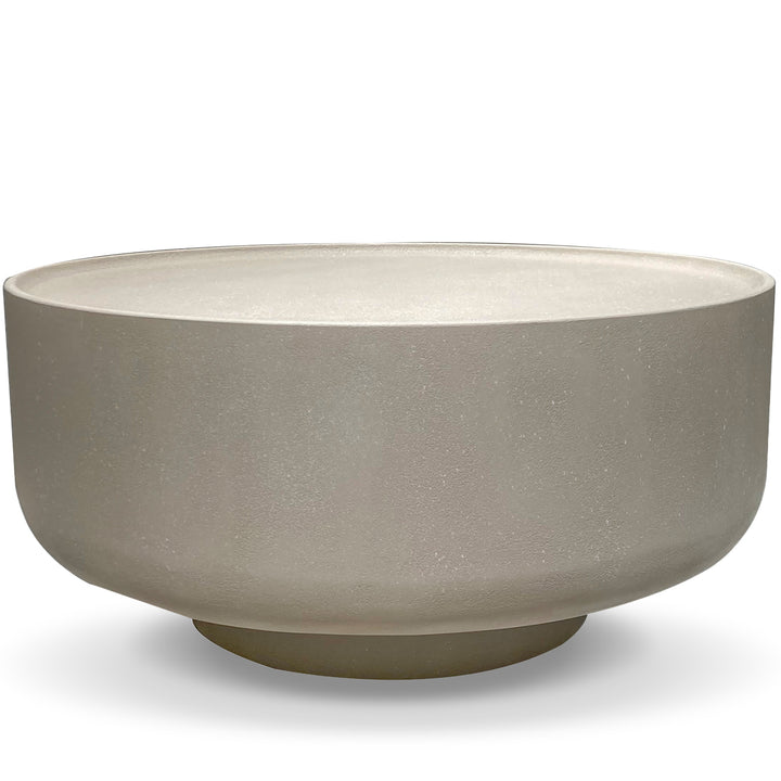 Japandi microcement round coffee table ova in white background.