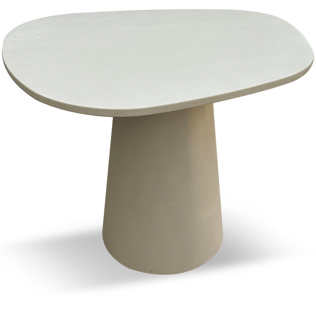 Japandi microcement round dining table voro in white background.