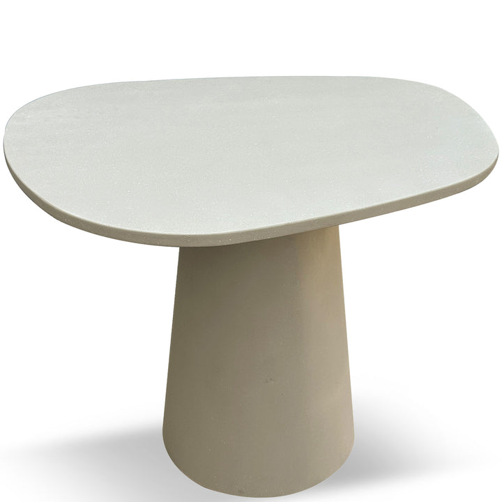 Japandi microcement round dining table voro in white background.