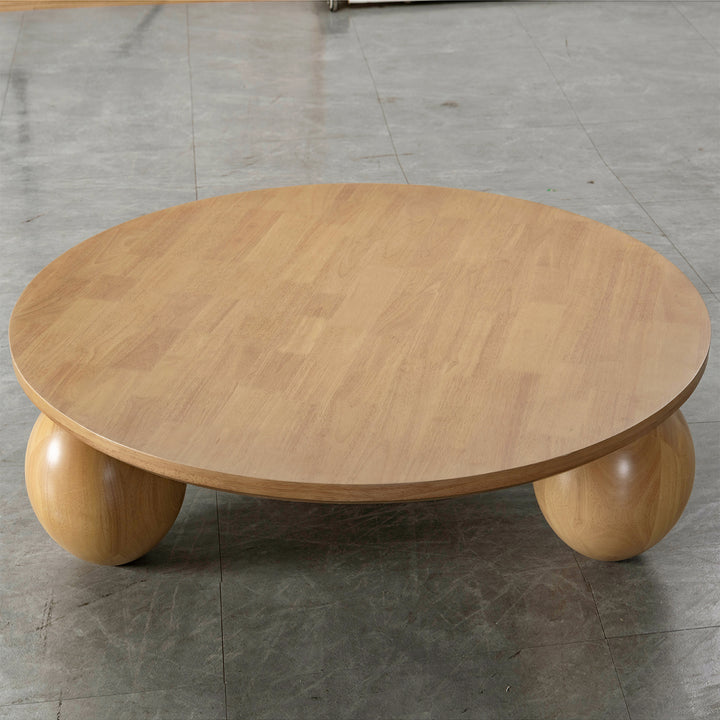 Japandi rubber wood coffee table tumbo with context.