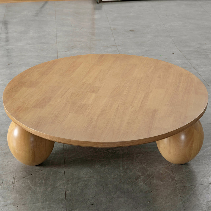 Japandi rubber wood coffee table tumbo with context.