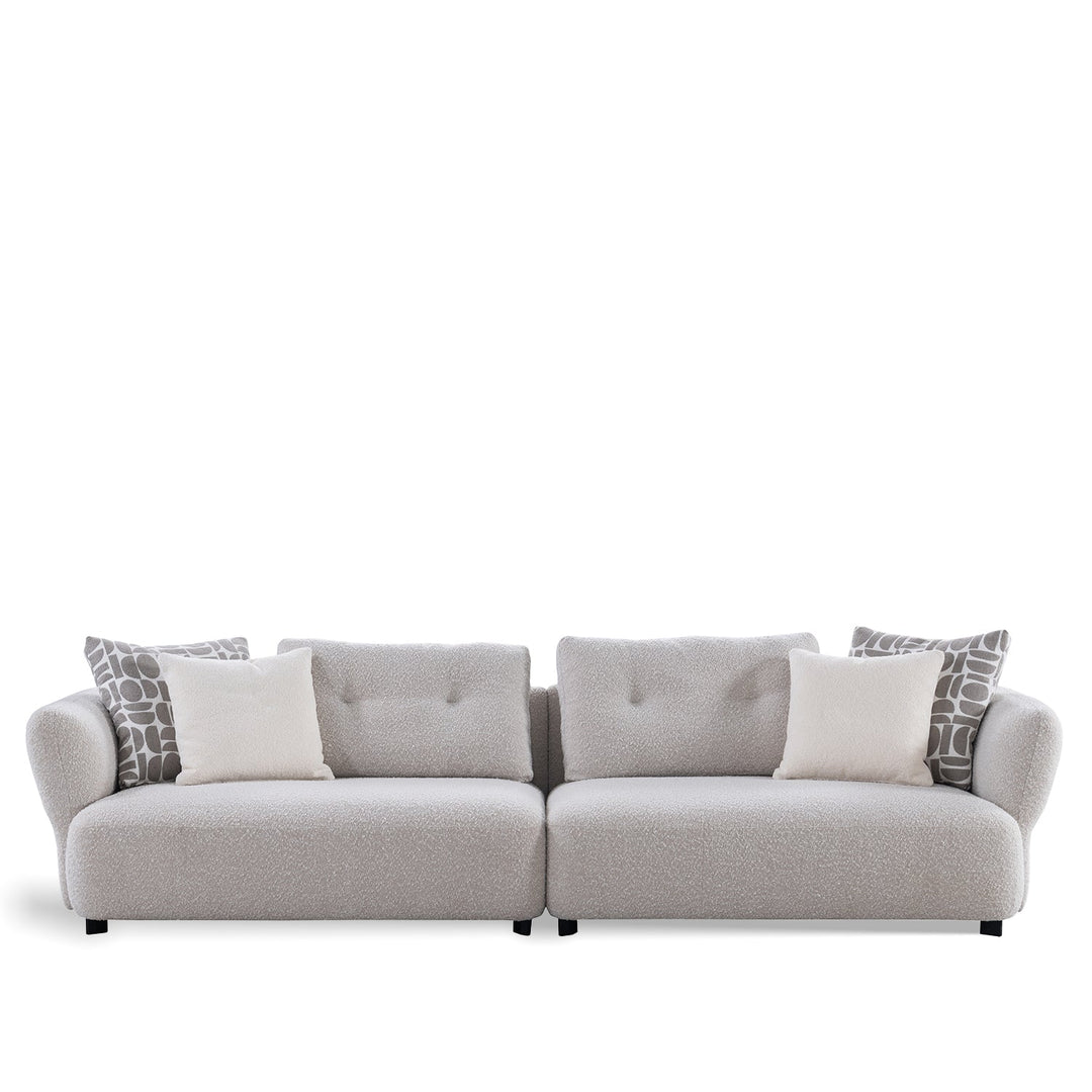 Minimalist boucle fabric 4.5 seater sofa couch in white background.