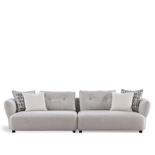 Modern boucle fabric 4 seater sofa couch in white background.