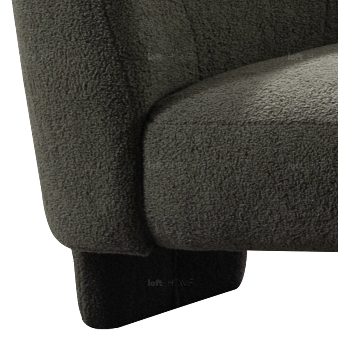 Minimalist fabric 1 seater sofa atrium with context.