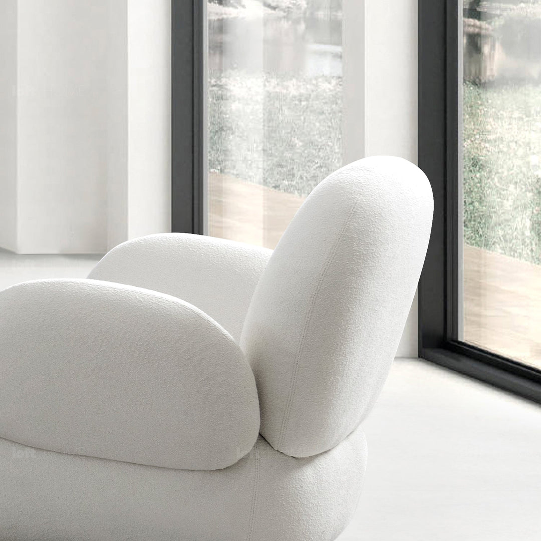 Minimalist fabric 1 seater sofa boucle in panoramic view.