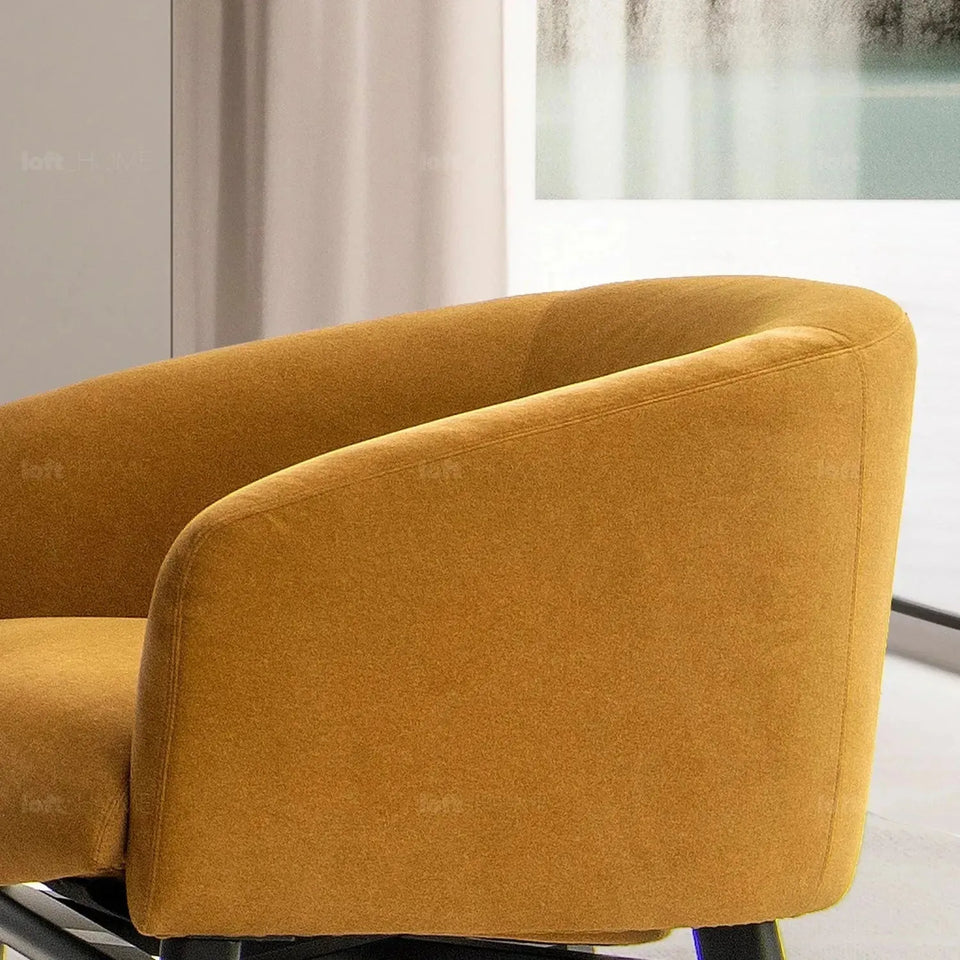Modern suede fabric 1 seater sofa ginge in close up details.