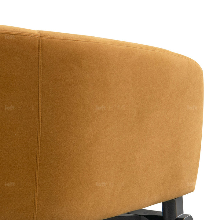 Minimalist fabric 1 seater sofa ginge in close up details.