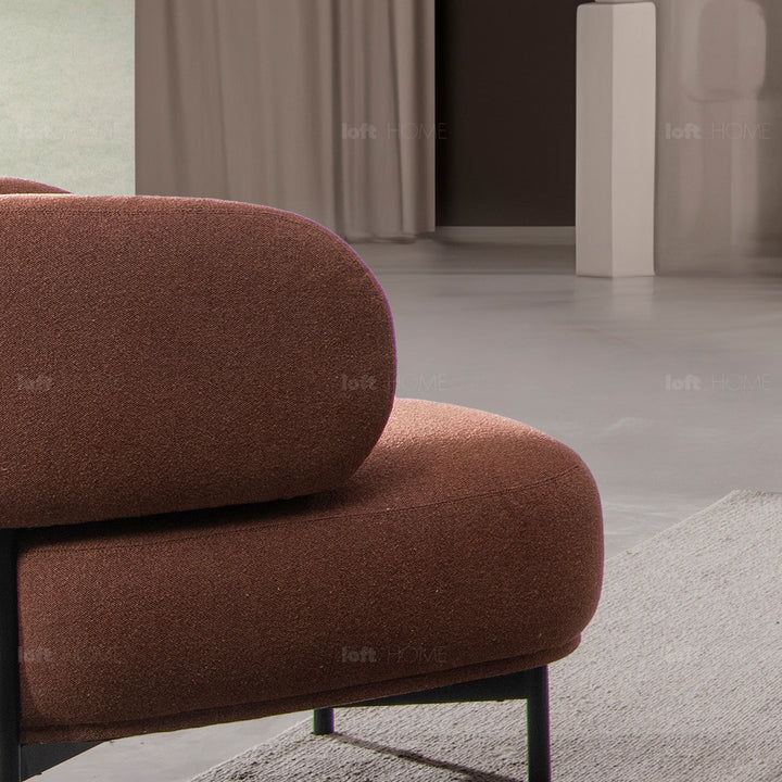 Minimalist fabric 1 seater sofa hinger in still life.