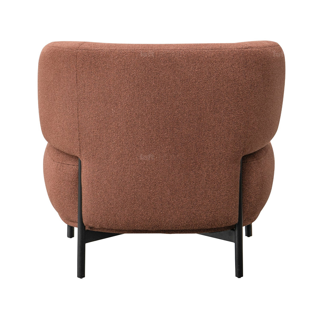 Minimalist fabric 1 seater sofa hinger with context.
