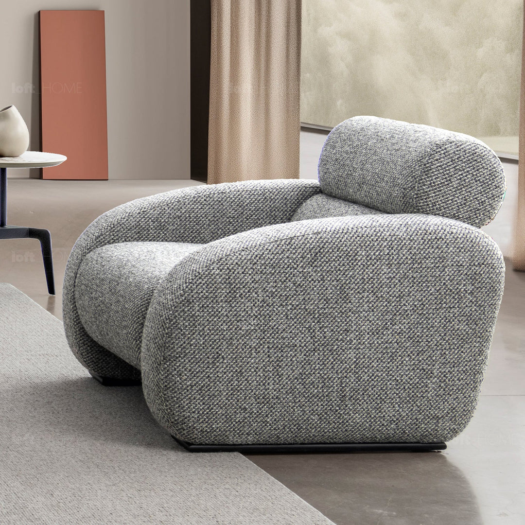 Minimalist fabric 1 seater sofa monolithe in panoramic view.