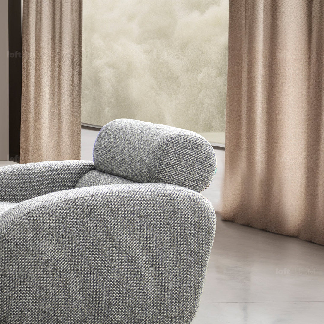 Minimalist fabric 1 seater sofa monolithe in still life.