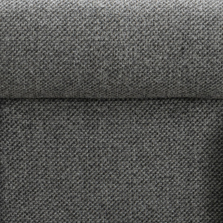 Minimalist fabric 1 seater sofa monolithe in close up details.