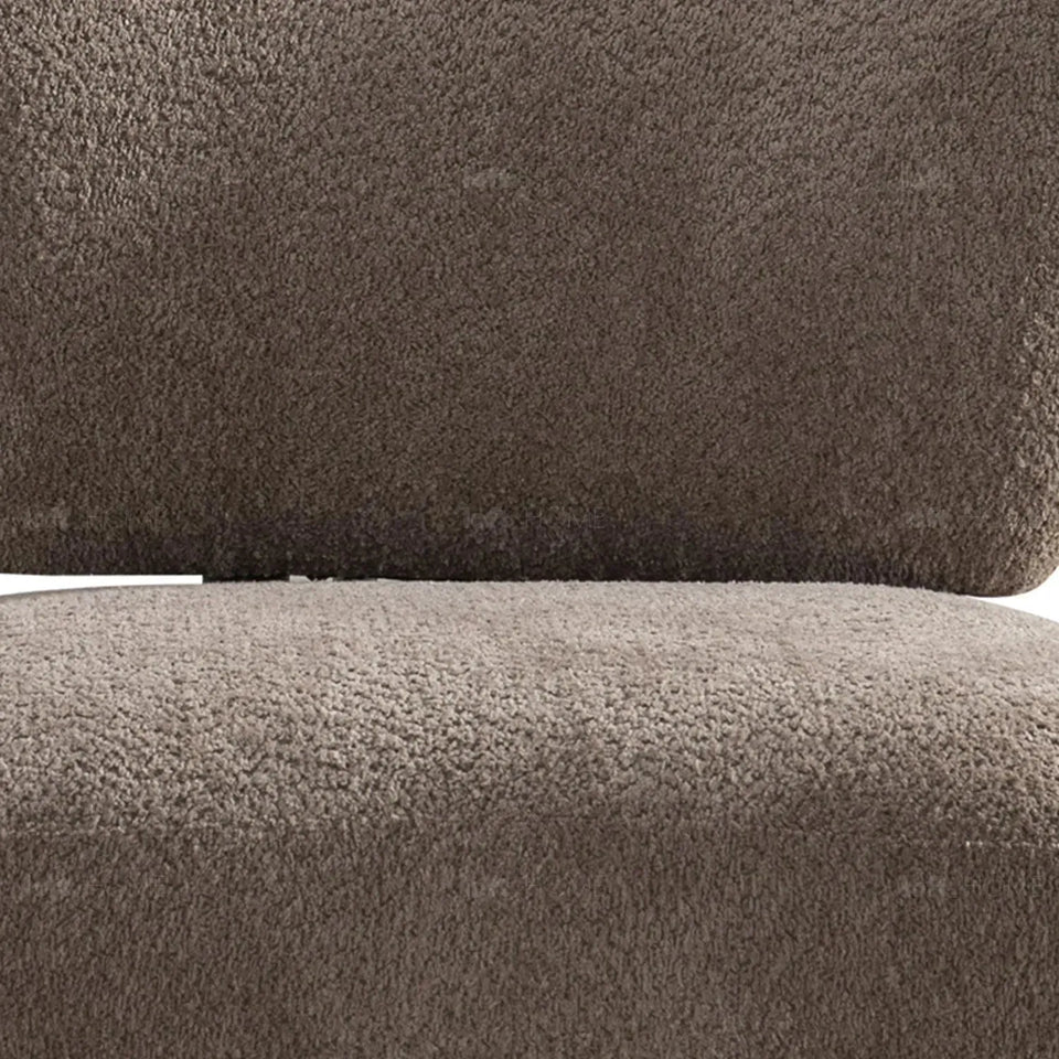 Cream sherpa fabric revolving 1 seater sofa rite in panoramic view.