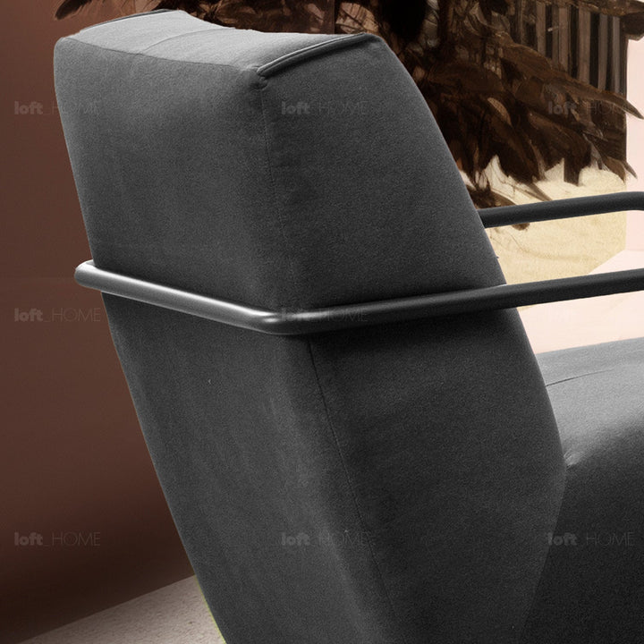 Minimalist fabric 1 seater sofa talc metal in still life.