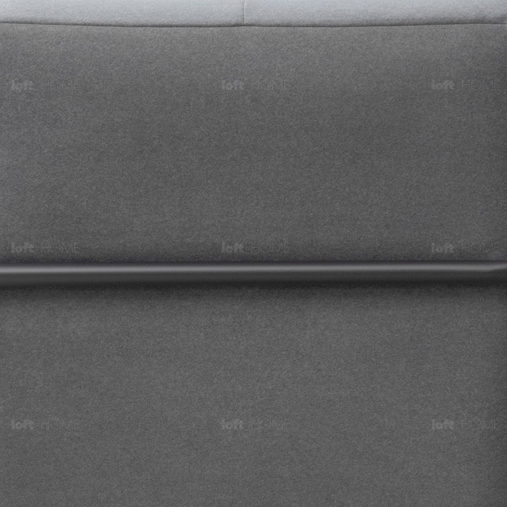 Minimalist fabric 1 seater sofa talc metal in close up details.