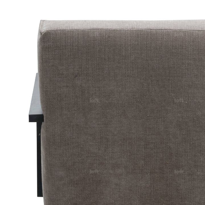 Minimalist fabric 1 seater sofa talc wood in close up details.