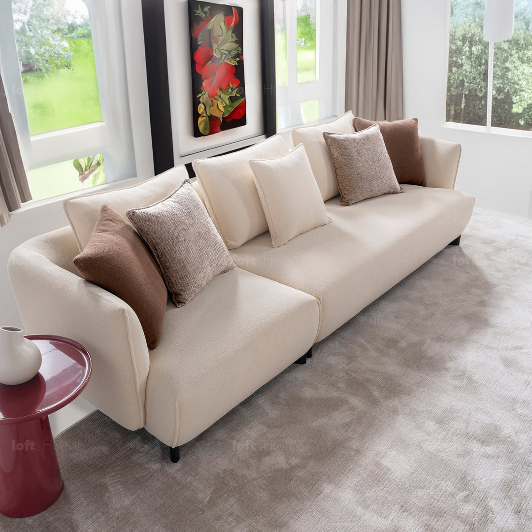 Minimalist fabric 3 seater sofa angler in still life.