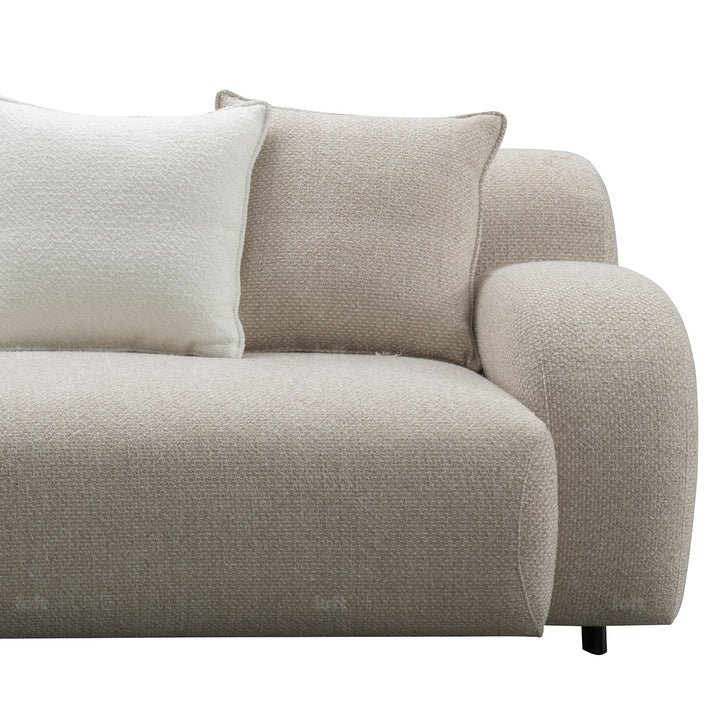 Minimalist fabric 4 seater sofa ench in close up details.