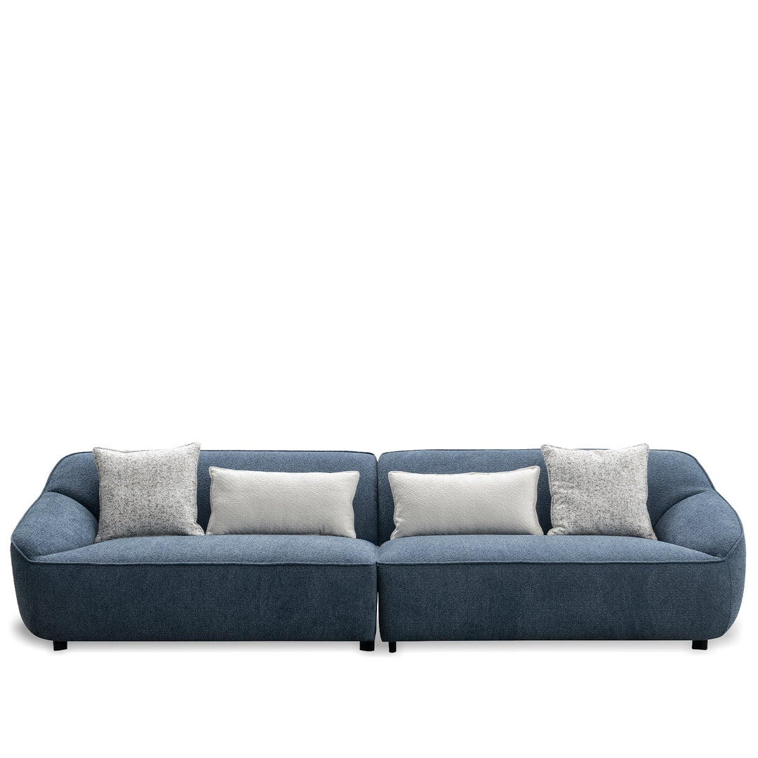 Minimalist fabric 4 seater sofa nep in white background.