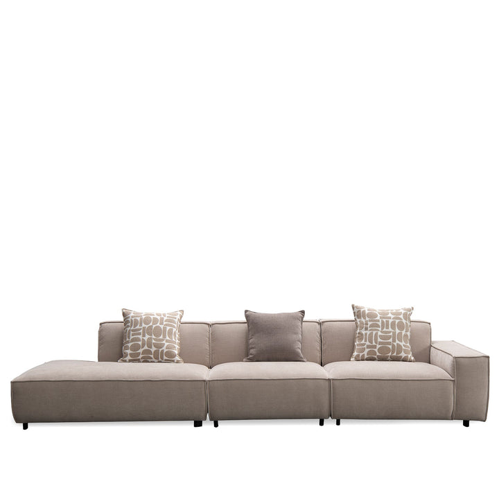 Minimalist fabric 4.5 seater sofa glade in still life.