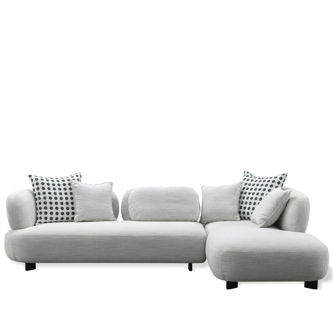 Minimalist fabric l shape sectional sofa monti 4+l in white background.
