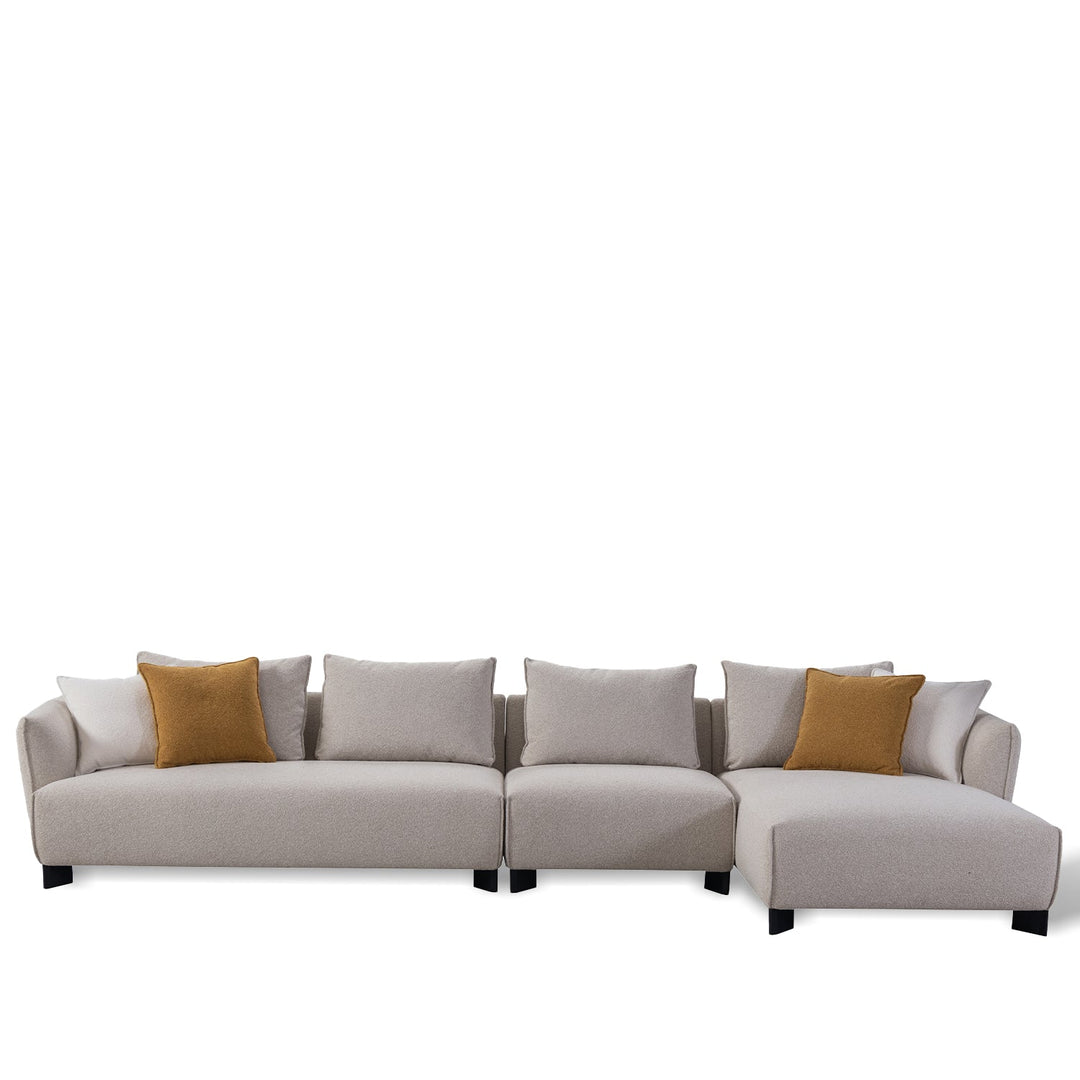 Minimalist fabric l shape sectional sofa nest 3+ l in white background.