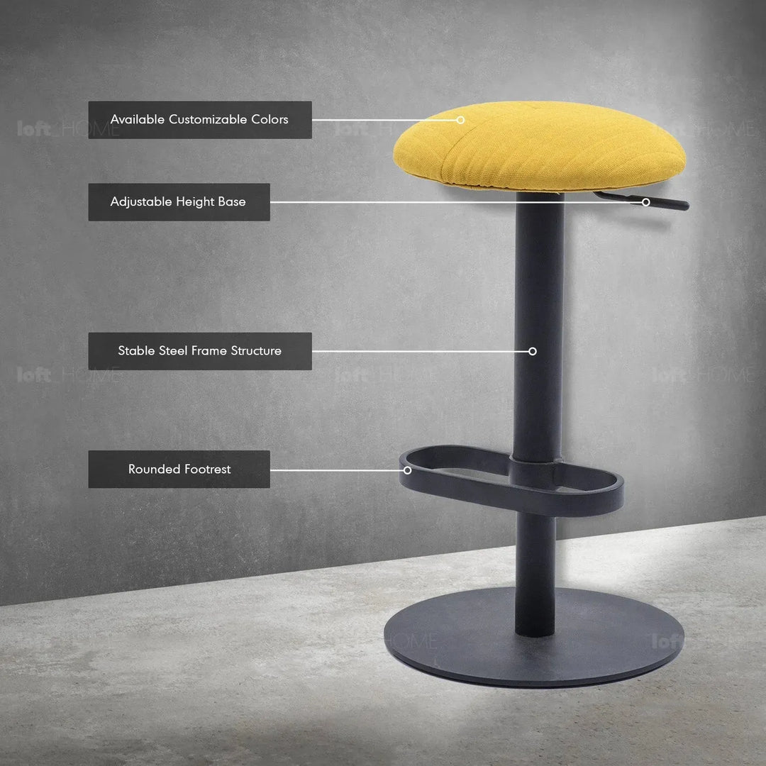 Minimalist fabric round bar stool shell in close up details.