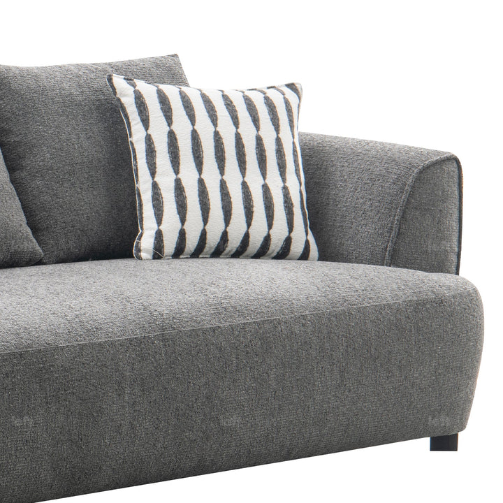 Minimalist mixed weave fabric 3.5 seater sofa oble with context.
