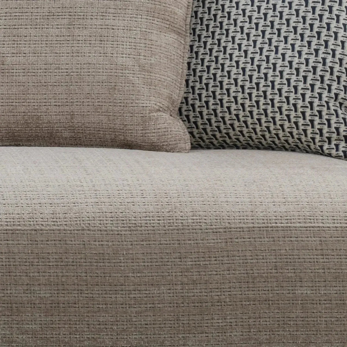 Modern mixed weave fabric 4 seater sofa ense in panoramic view.