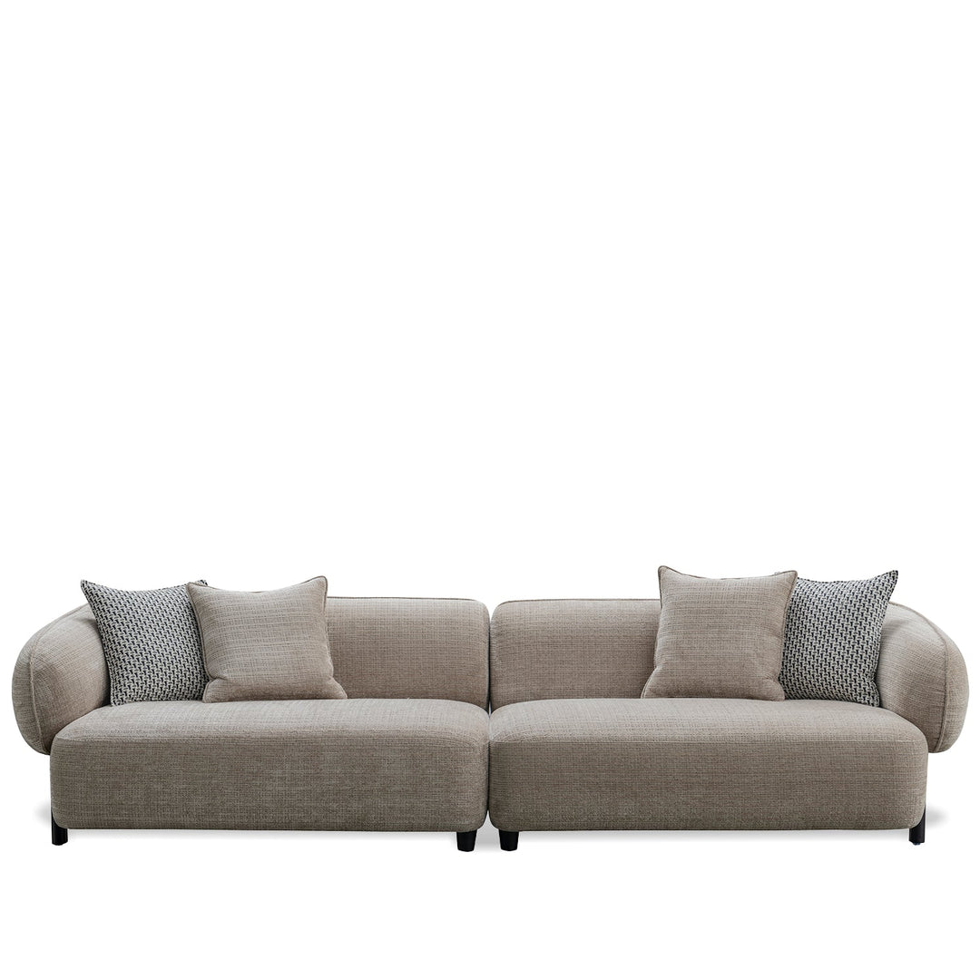 Minimalist mixed weave fabric 4 seater sofa ense in white background.