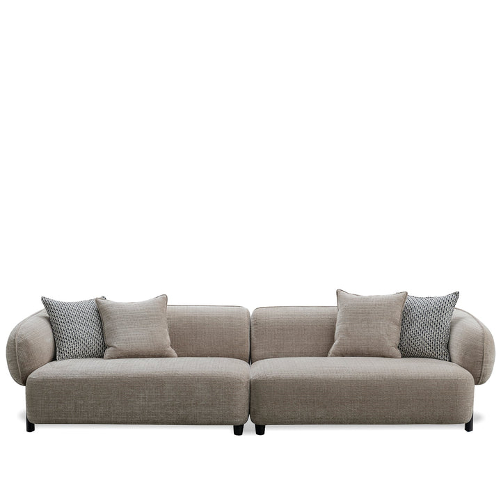 Minimalist mixed weave fabric 4 seater sofa ense in white background.