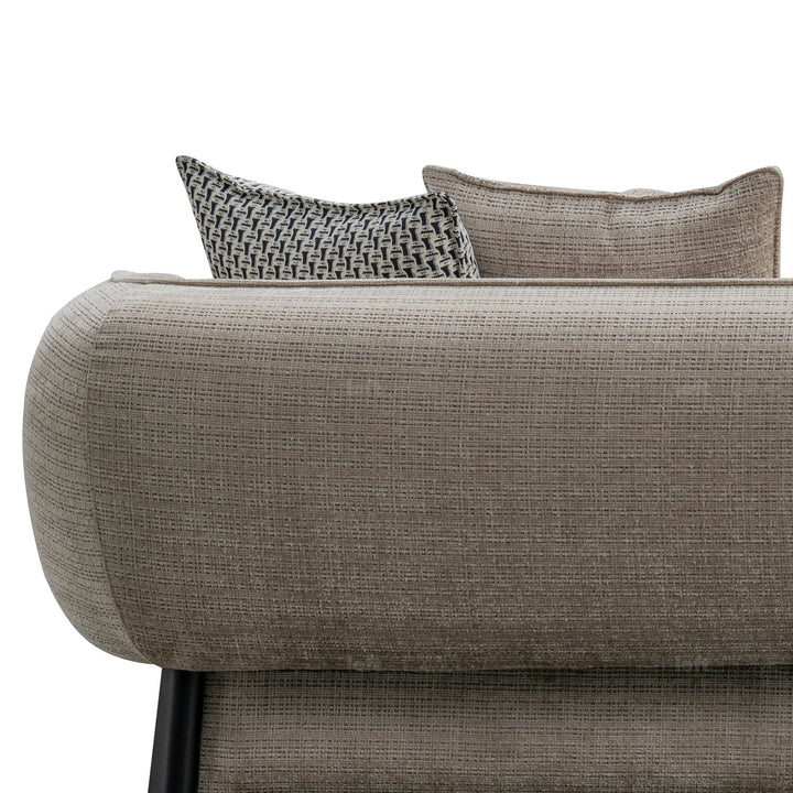 Minimalist mixed weave fabric 4 seater sofa ense with context.