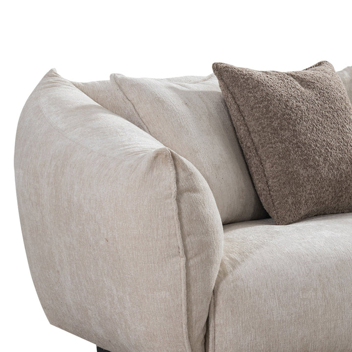 Minimalist mixed weave fabric 4 seater sofa nest with context.