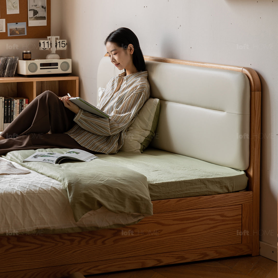 Minimalist oak wood microfiber leather storage bed luna with context.