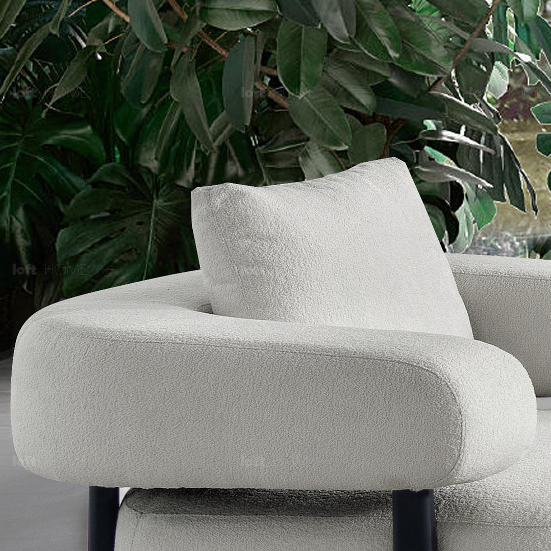 Minimalist sherpa fabric 1 seater sofa simplicity in close up details.