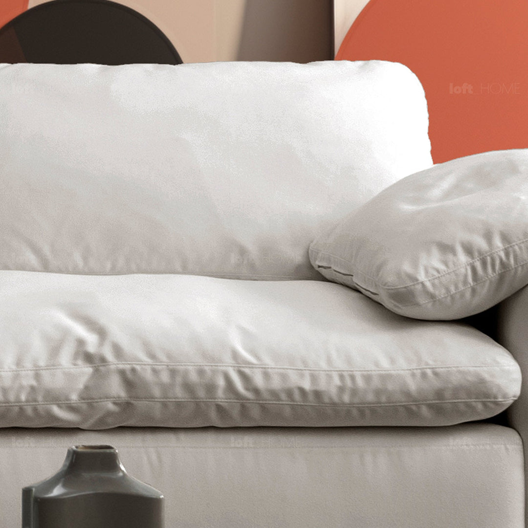 Minimalist suede fabric 4.5 seater sofa cloud in still life.