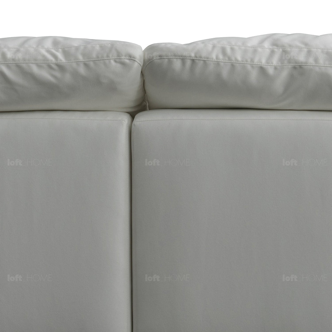 Minimalist suede fabric 4.5 seater sofa cloud in close up details.