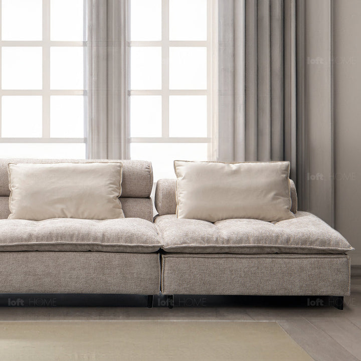 Minimalist fabric 4.5 seater sofa aumn in close up details.