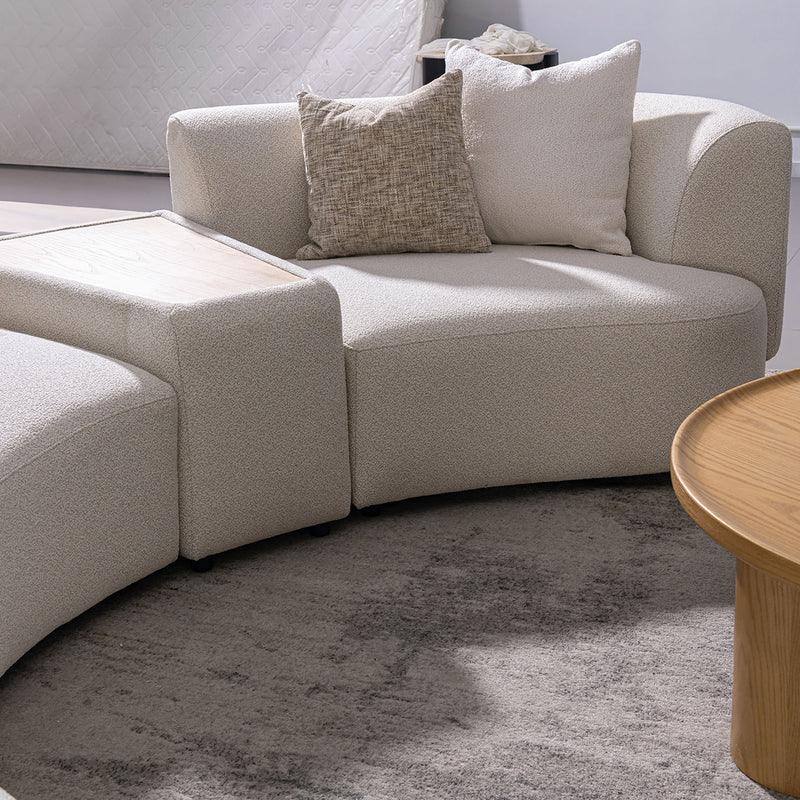 Modern boucle fabric modular 2 seater sofa with side table rene in close up details.