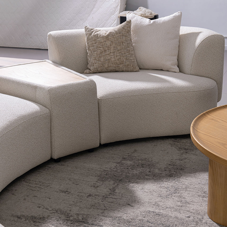 Modern boucle fabric modular 2 seater sofa with side table rene in close up details.