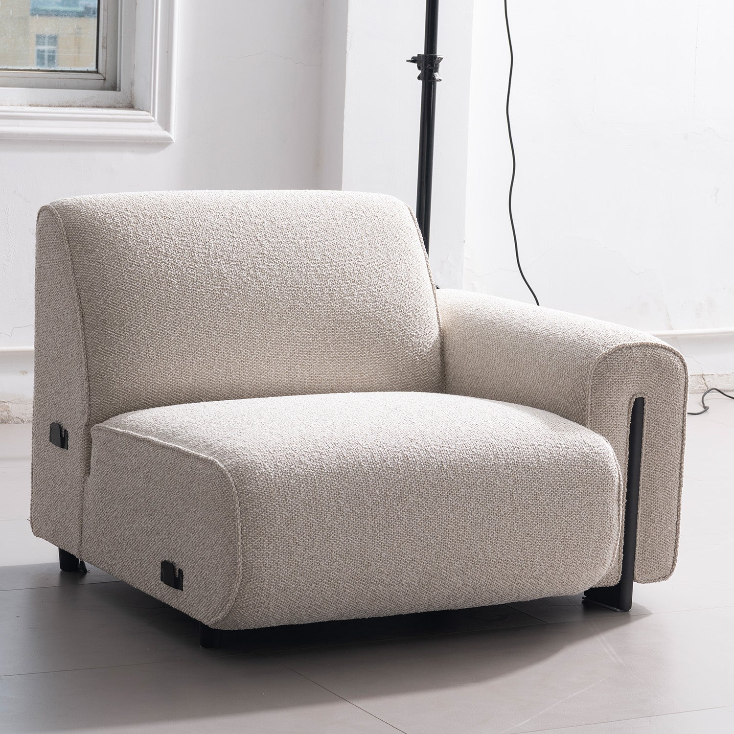Minimalist boucle fabric modular 3 seater sofa colle in close up details.