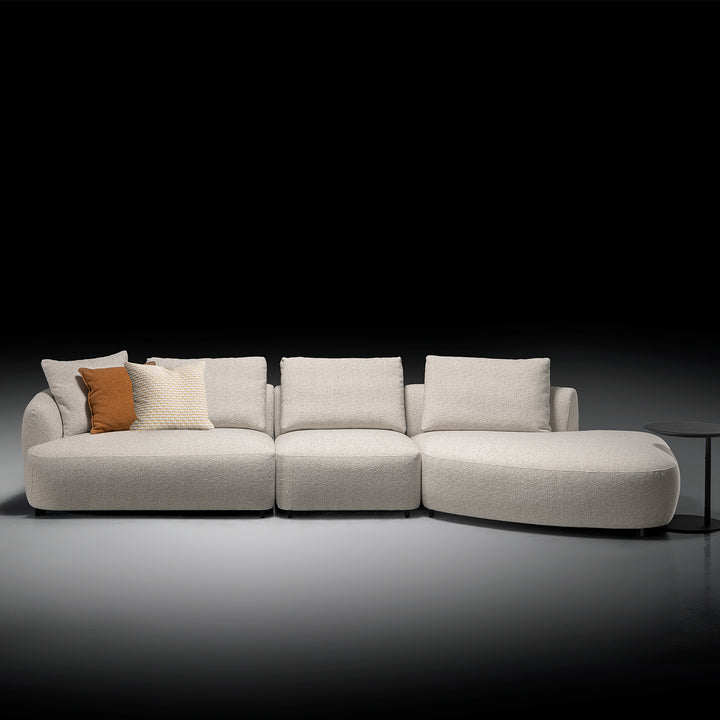 Modern boucle fabric modular chaise 2 seater sofa serene in still life.