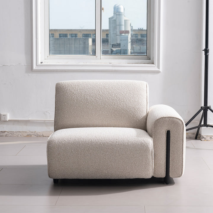 Modern boucle fabric modular corner 1 seater sofa colle in panoramic view.