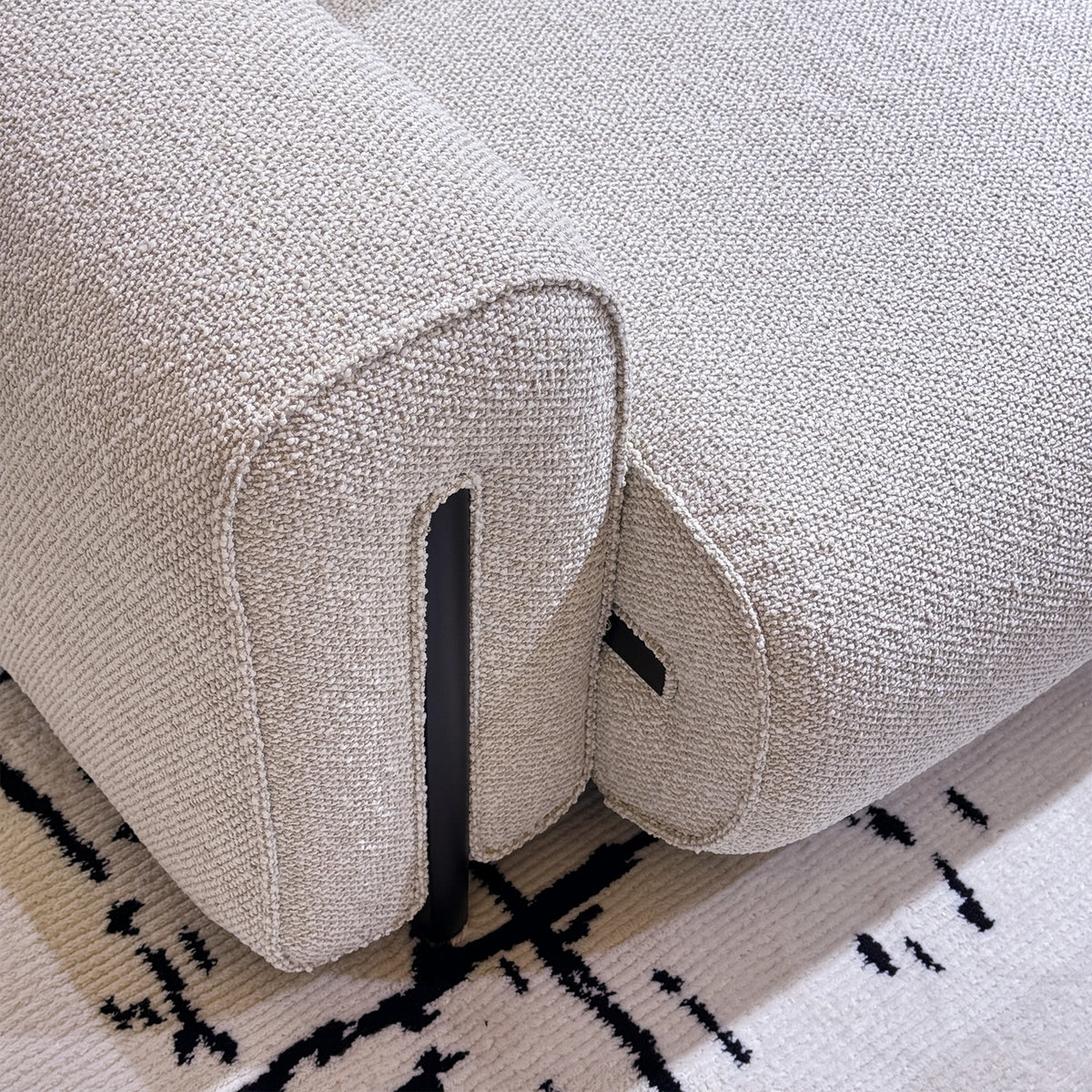 Minimalist boucle fabric modular corner 1 seater sofa colle in panoramic view.