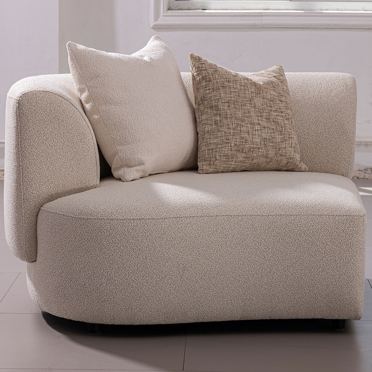 Modern boucle fabric modular corner 1 seater sofa rene in panoramic view.